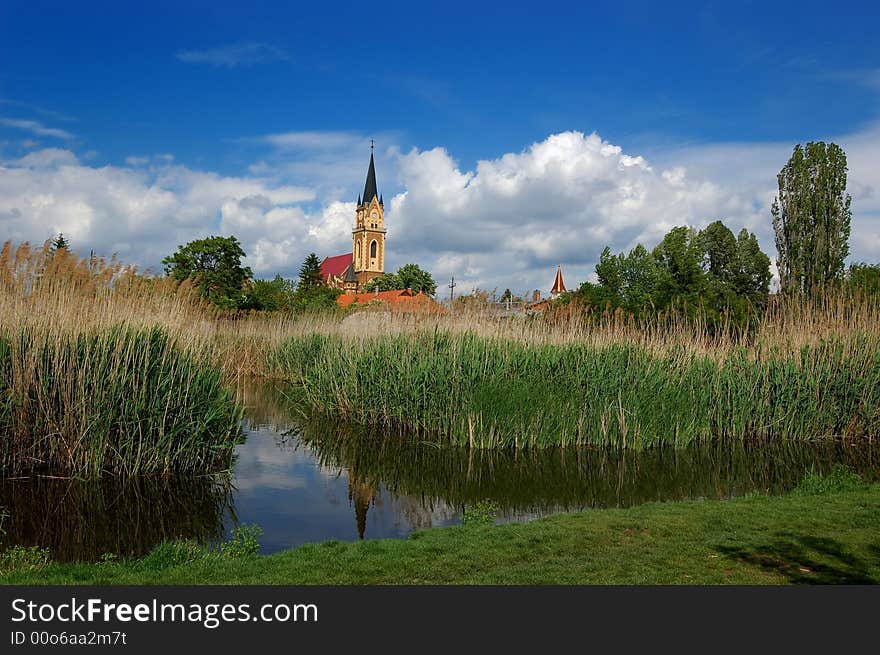 Church tower on the lakeside. Church tower on the lakeside.