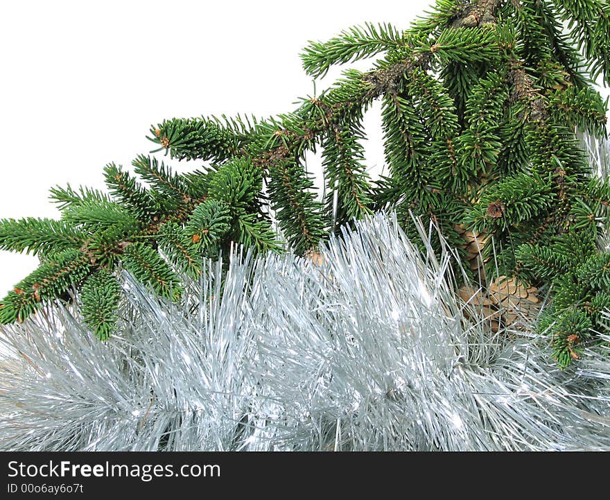 Branch of New Year's fur-trees with strobile. A christmas fur-tree, a celebratory tree, and a silvery tinsel. Branch of New Year's fur-trees with strobile. A christmas fur-tree, a celebratory tree, and a silvery tinsel