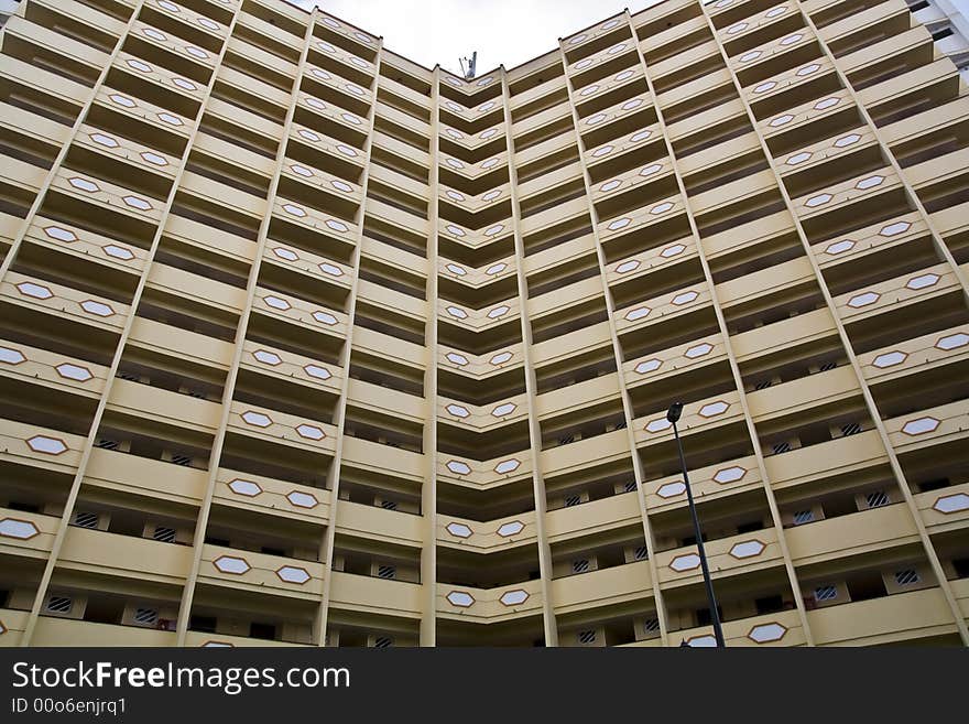 Angled building with a lot of apartments. Angled building with a lot of apartments