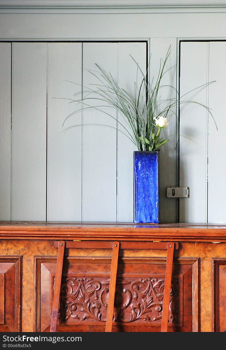 Vases of white roses on a piano.