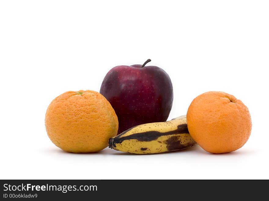 A banana, two tangerines and an apple on a white background. A banana, two tangerines and an apple on a white background