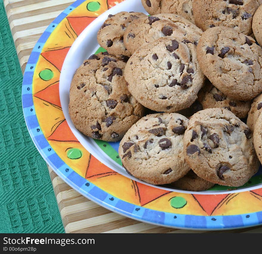 A plate of chocolate chip cookies. A plate of chocolate chip cookies.