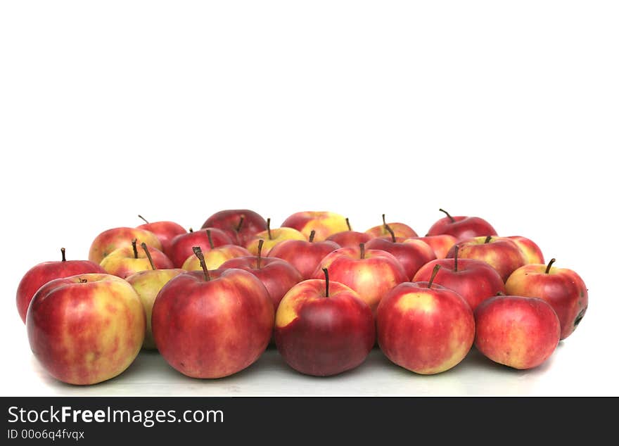 Many red apples on a white background