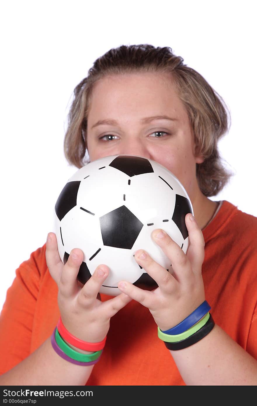 Soccer fan holding football in front of face. Soccer fan holding football in front of face