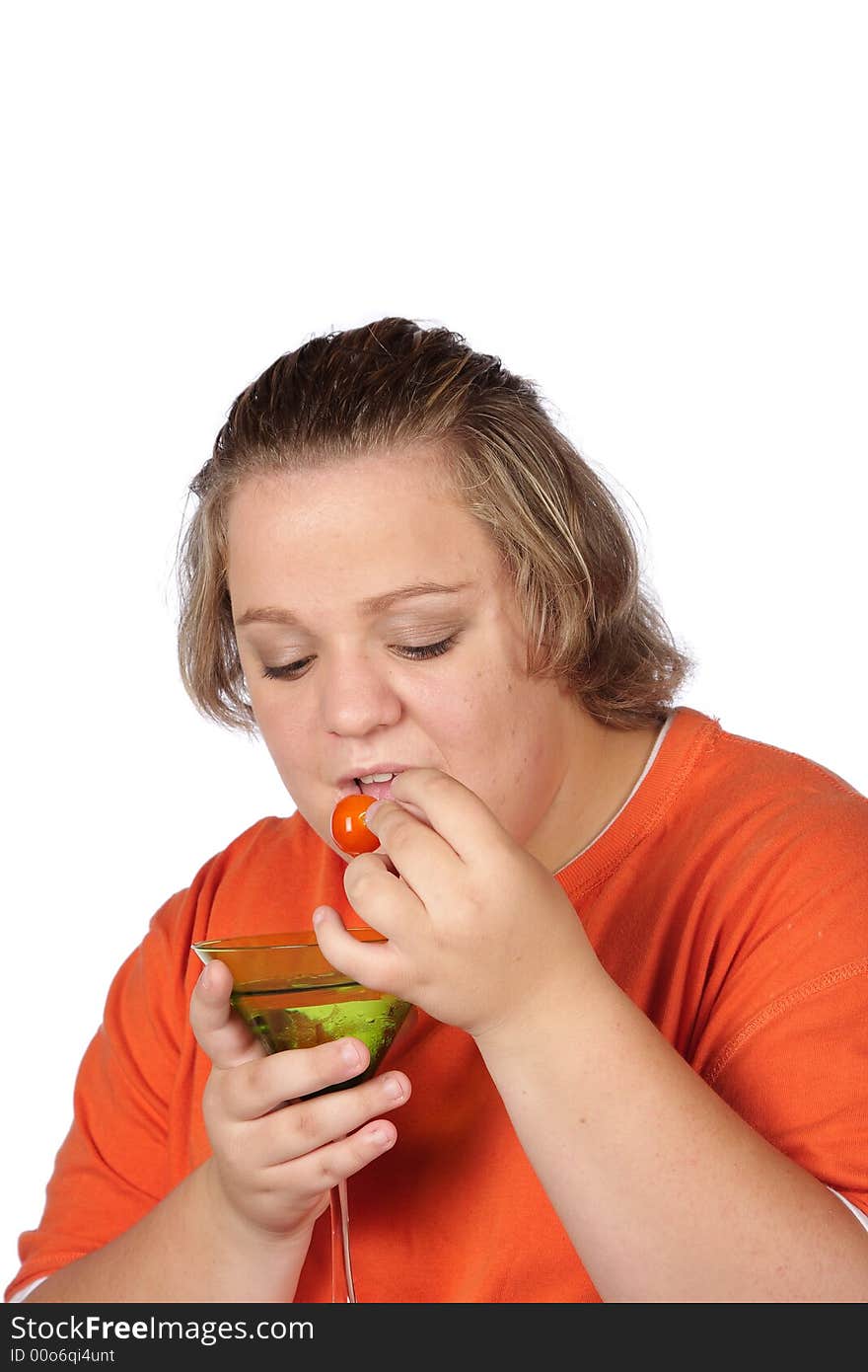 Young model with martini glass eating the cherry. Young model with martini glass eating the cherry