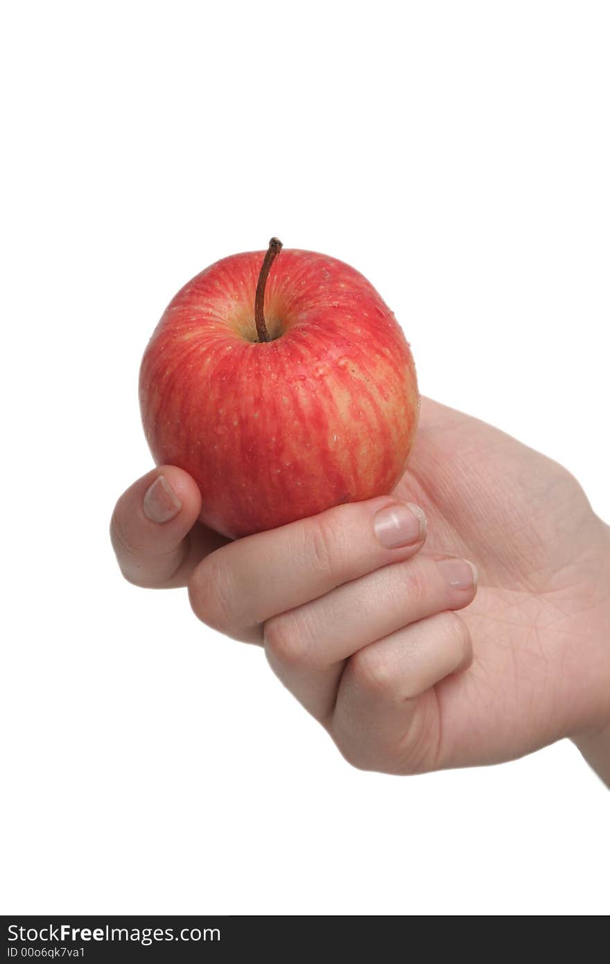 Tasty juicy apple in a hand on a white background