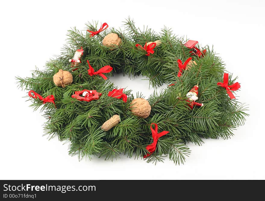 Advent wreath with walnuts, red ribbon