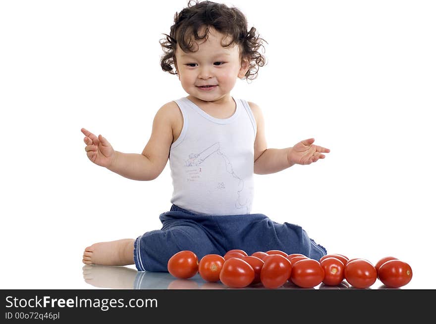 Child with tomato, isolated on a white background. Child with tomato, isolated on a white background.