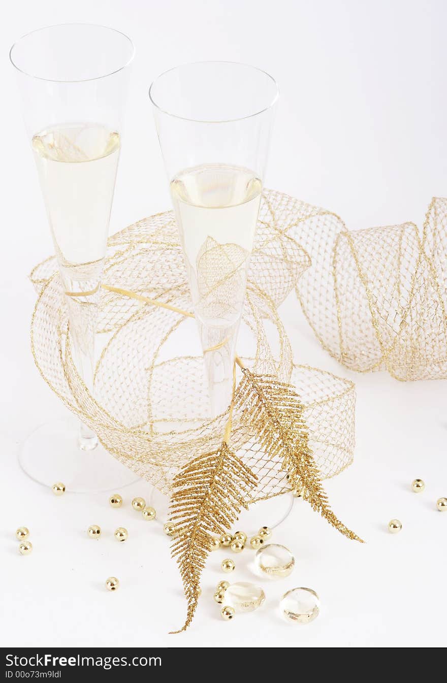 Two glasses of champagne on white background