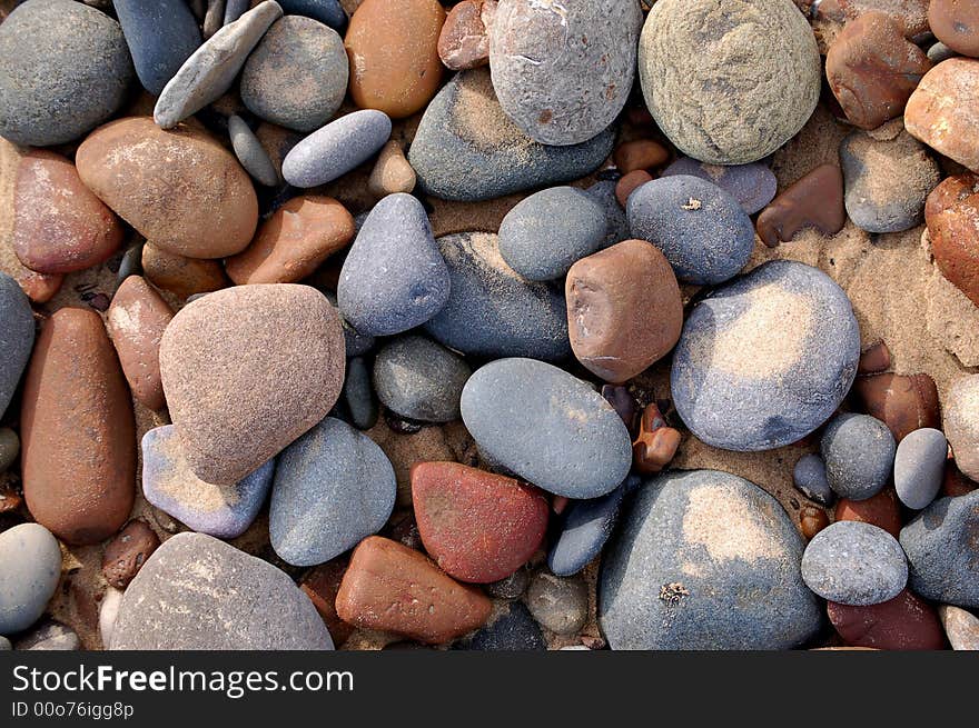 Lots of different color pebbles on the beach