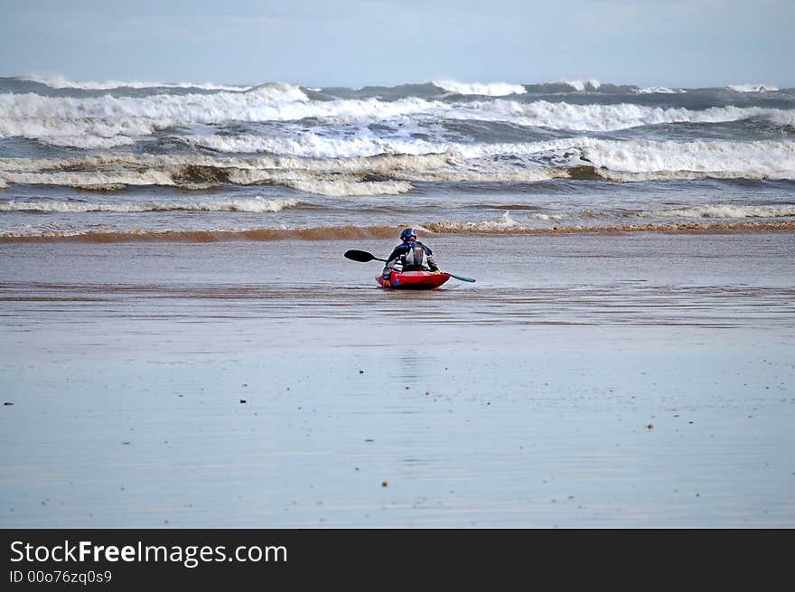 Man in canoe waiting for the sea