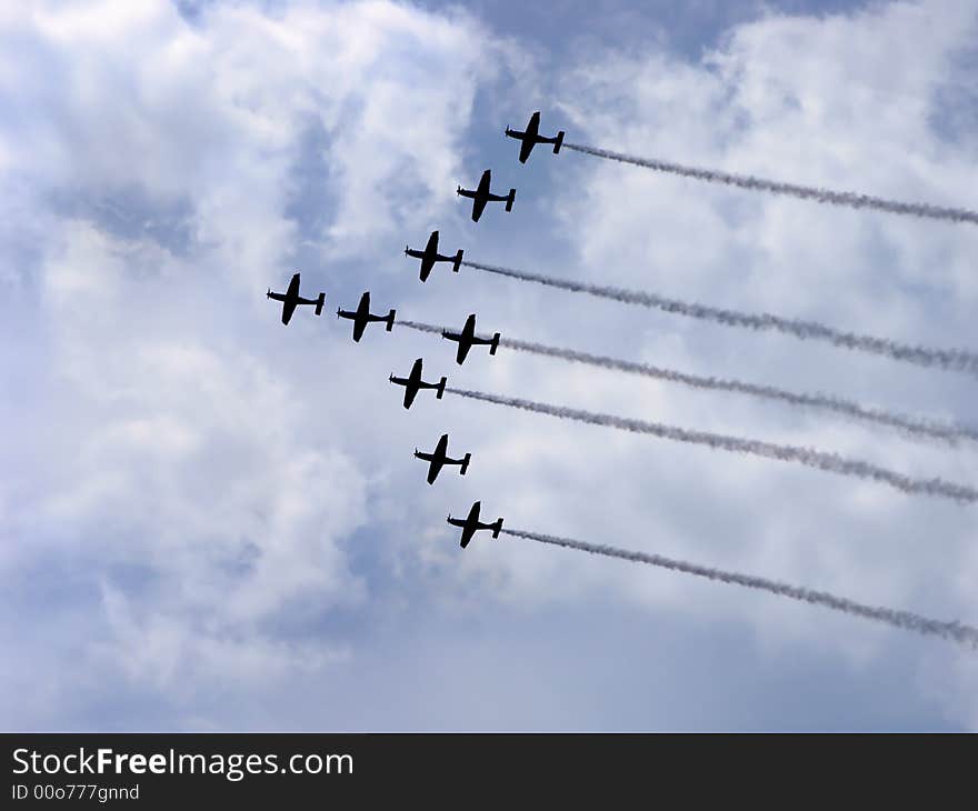 Acrobat propeller making smoke tail in the sky