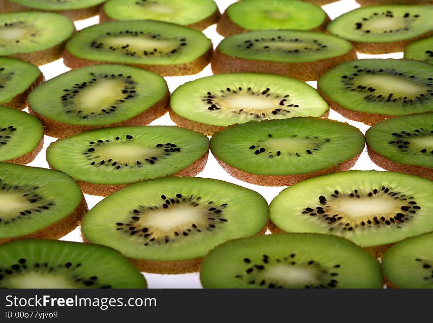 Slices of fresh kiwi background. Slices of fresh kiwi background