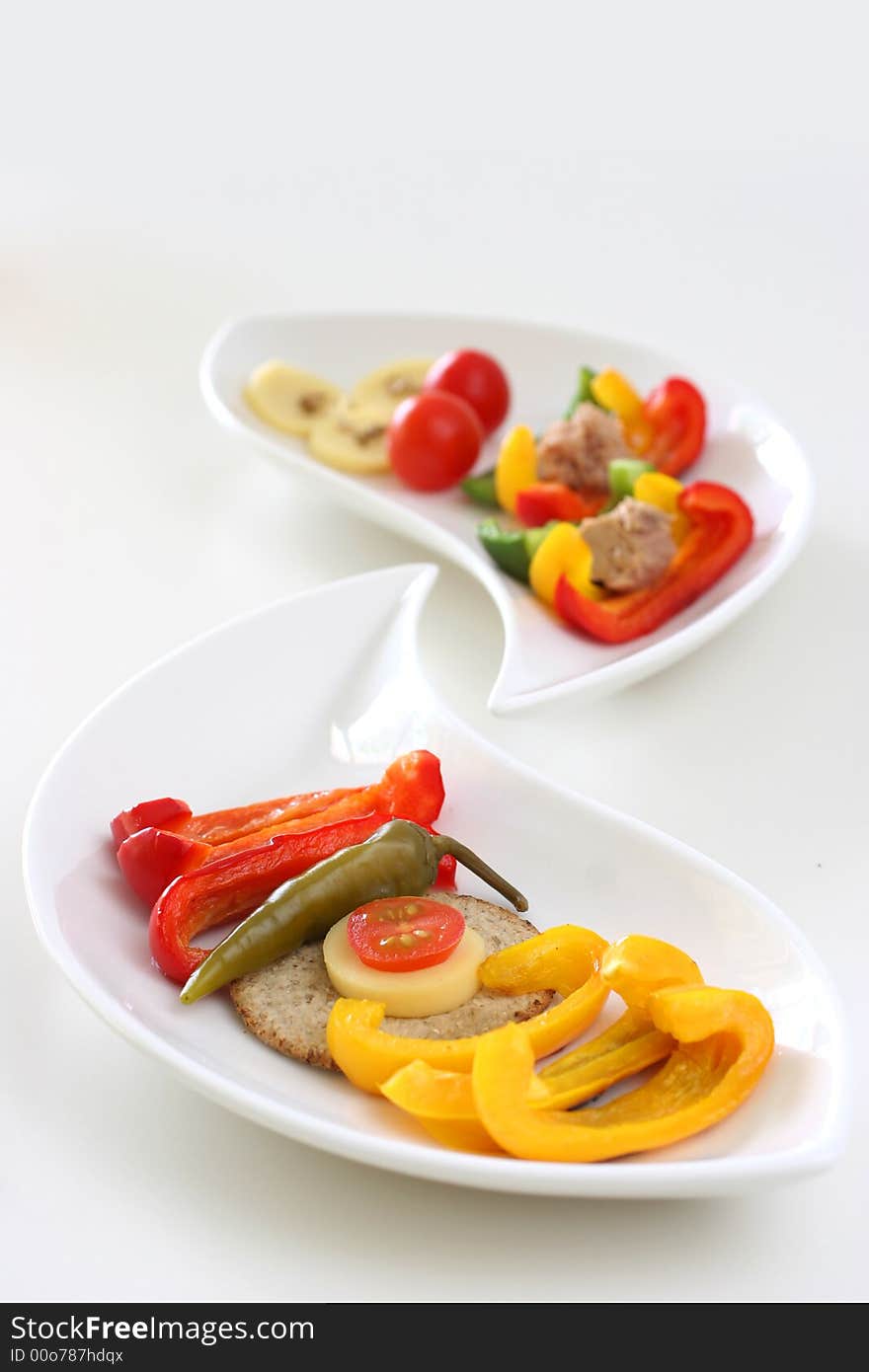 Healthy colorful platter with assorted vegetables on fancy white china. Healthy colorful platter with assorted vegetables on fancy white china