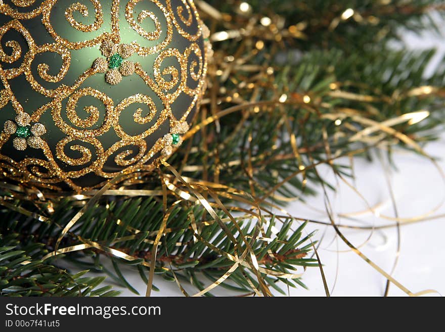 Christmas balls with gold ornament on the green pine branches. Christmas balls with gold ornament on the green pine branches