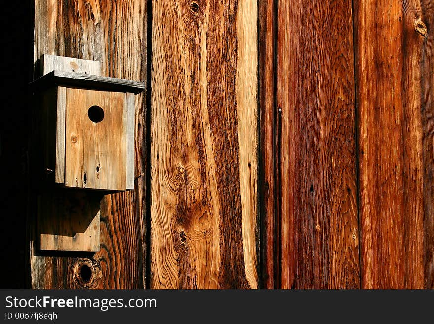 Old bird house on old but colorful barn wood located at Golden, Oregon (old ghost town). Old bird house on old but colorful barn wood located at Golden, Oregon (old ghost town)