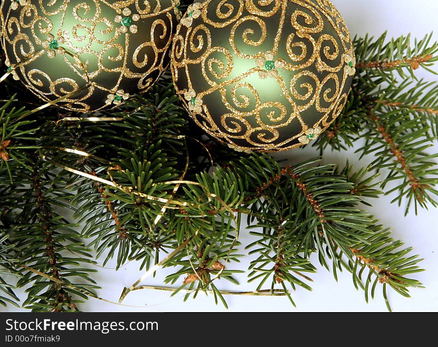 Christmas balls with gold ornament on the green pine branches. Christmas balls with gold ornament on the green pine branches