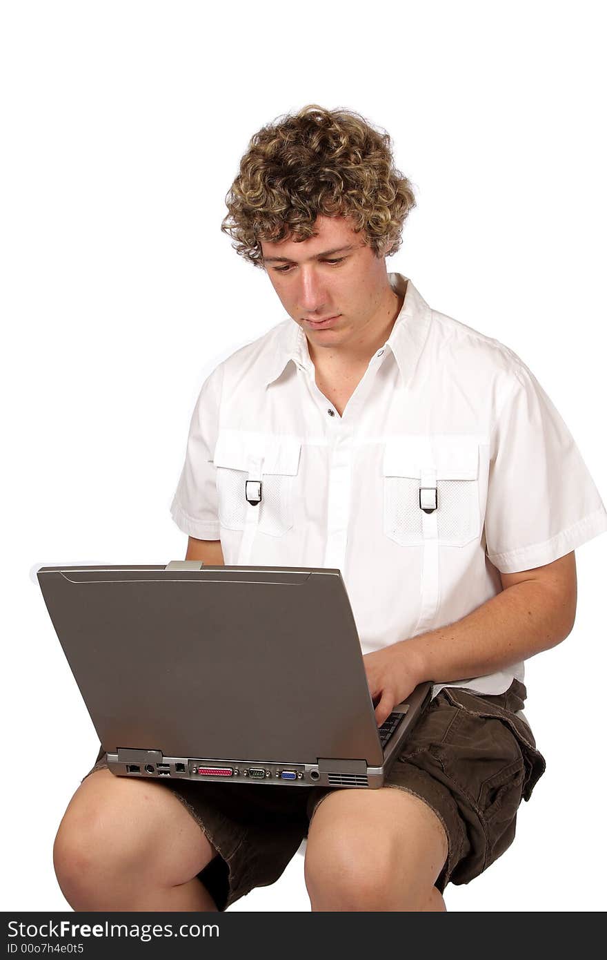 Yuppie working with laptop on his lap