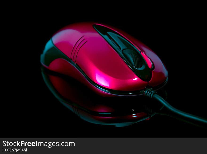 Computer mouse on reflective background