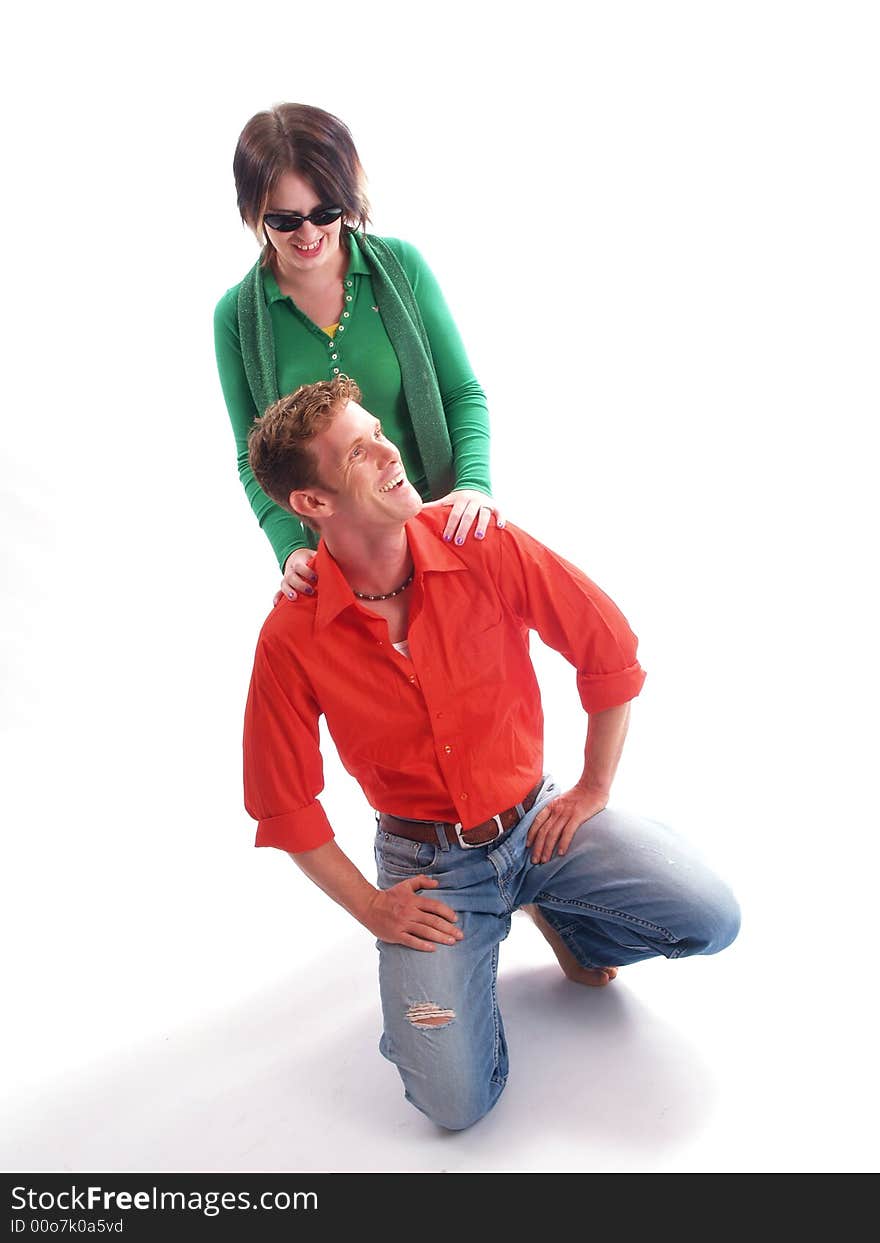 Young adult couple wearing red and green. Young adult couple wearing red and green