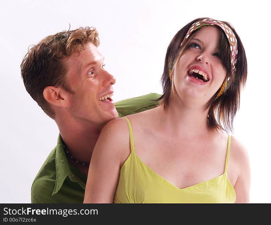 Young adult couple wearing green and having fun. Young adult couple wearing green and having fun