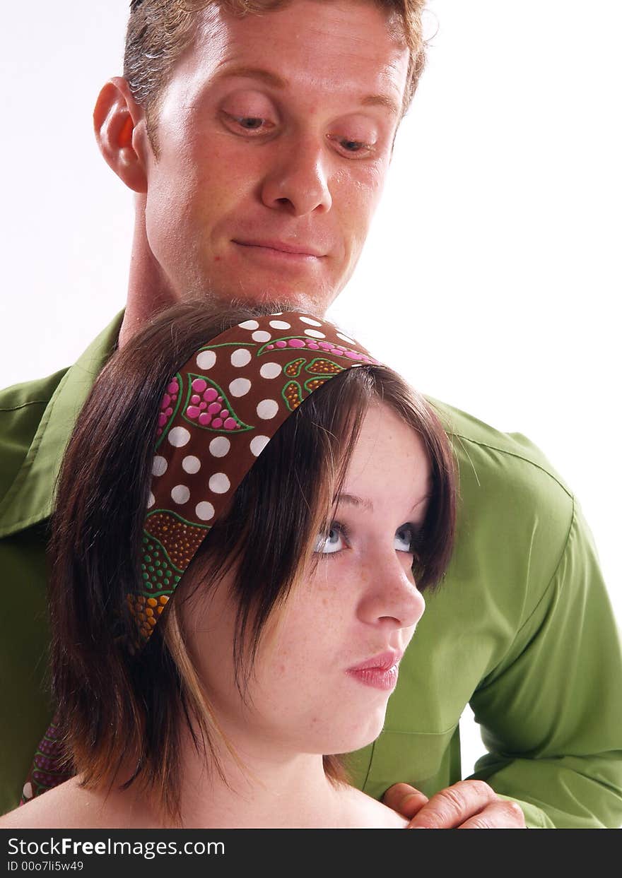 Young adult couple wearing green and having fun. Young adult couple wearing green and having fun