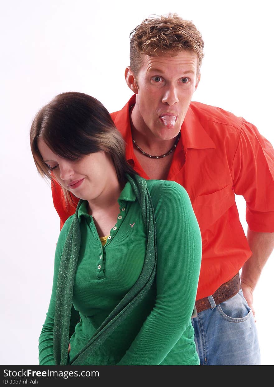 Young adult couple wearing red and green. Young adult couple wearing red and green