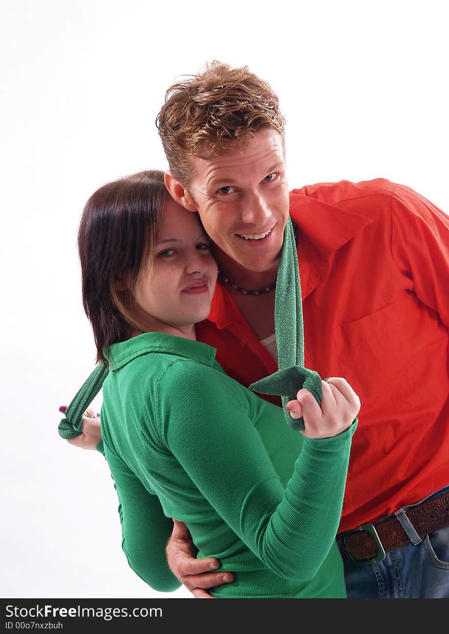 Young adult couple wearing red and green. Young adult couple wearing red and green