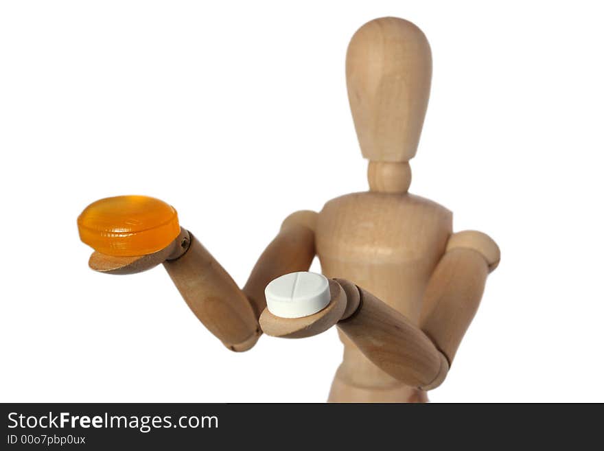 Wood mannequin choose orange or white pill. Wood mannequin choose orange or white pill