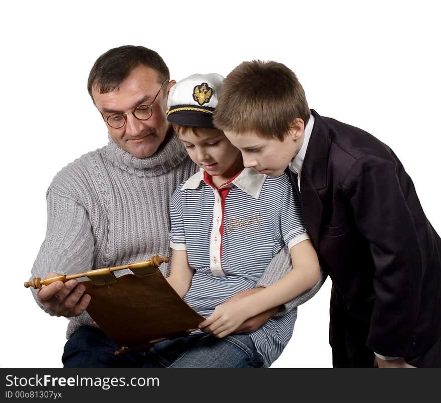 Studio. Isolated. The man shows a map and tells to boys about the far countries and travel. Studio. Isolated. The man shows a map and tells to boys about the far countries and travel