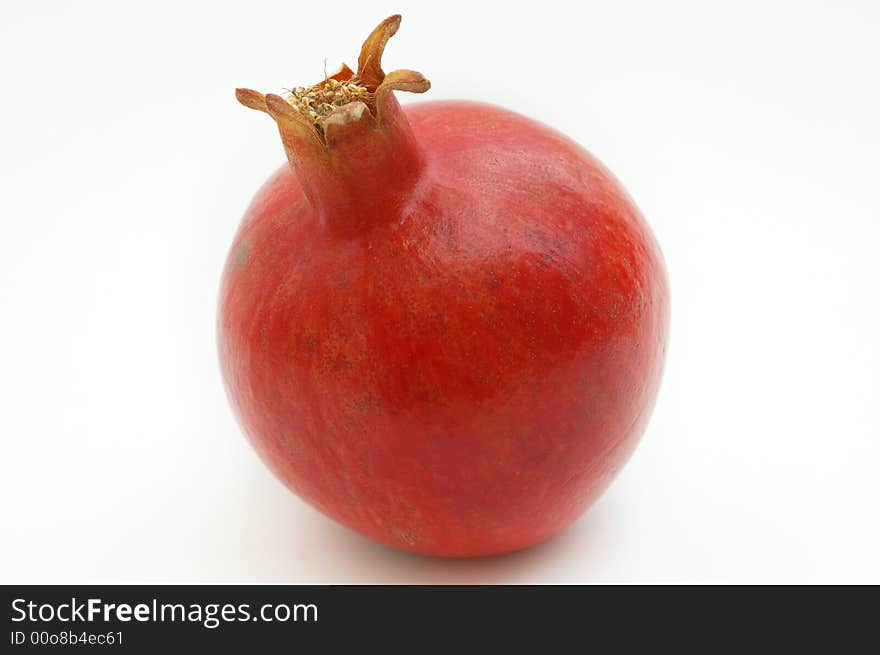 Ripe pomegranate on white isolated