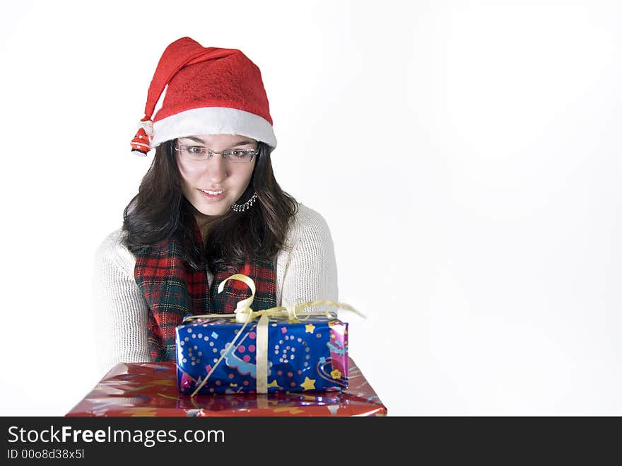 Beautiful girl is holdinh her christmas gifts