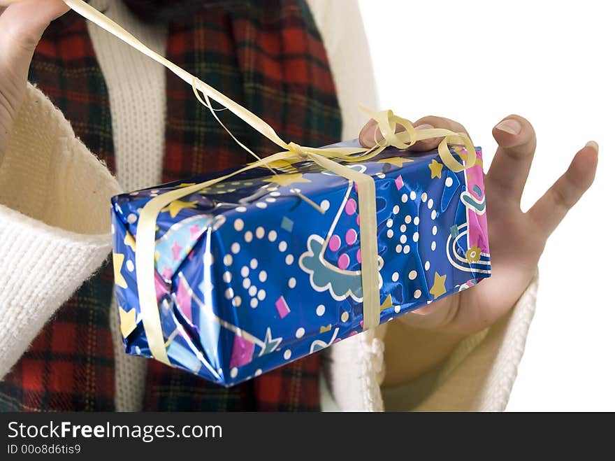 Girl unwrapping her christmas gift. Girl unwrapping her christmas gift