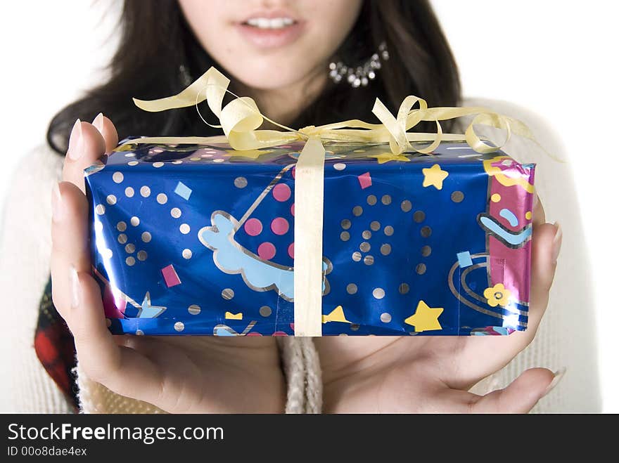 Girl holding her christmas gift. Girl holding her christmas gift