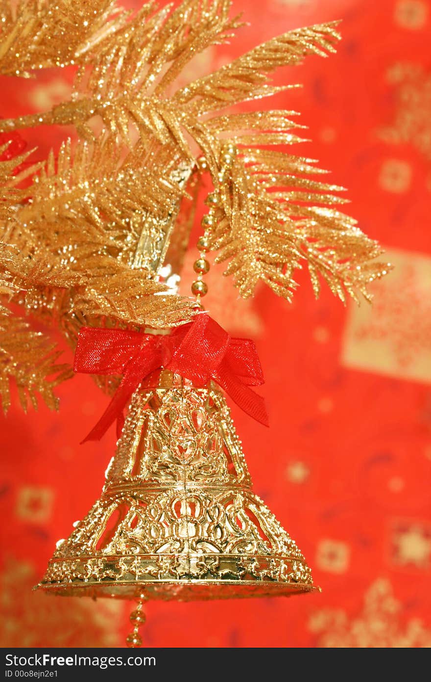 New-year handbells and Christmas tree on red background