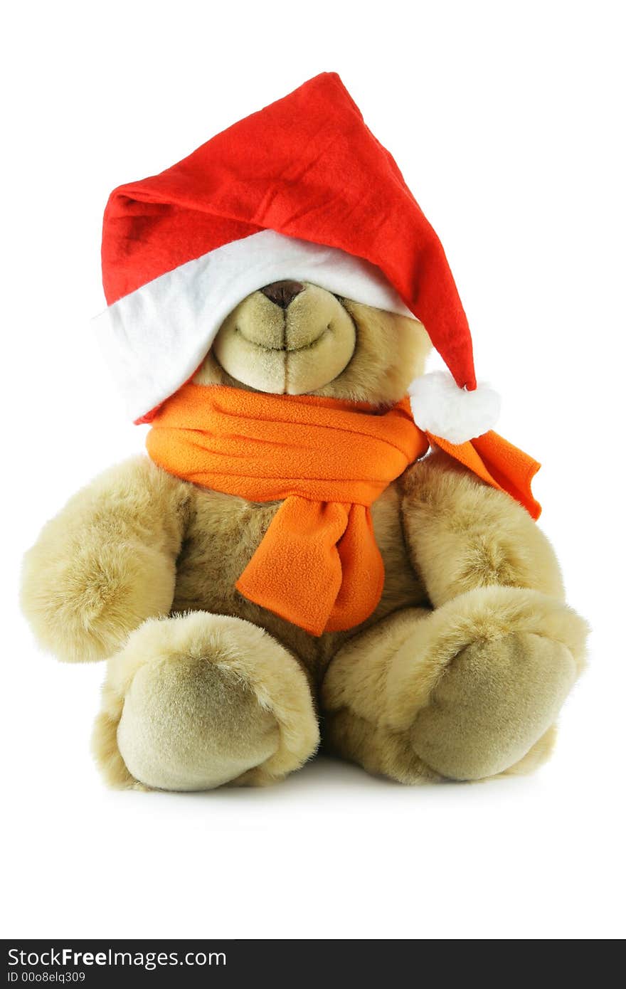 Teddy bear with big Santa hat isolated over a white background