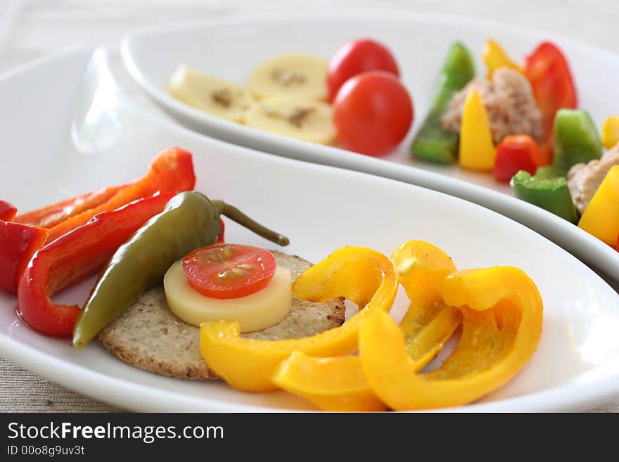 Healthy colorful platter with assorted vegetables on fancy white china. Healthy colorful platter with assorted vegetables on fancy white china