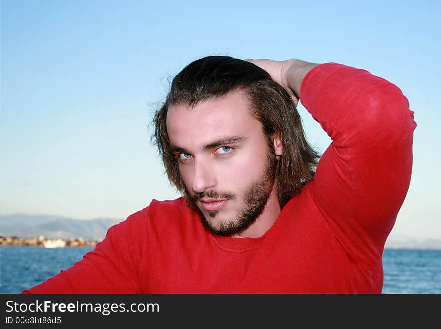 A handsome blonde young man portrait looking at the camera