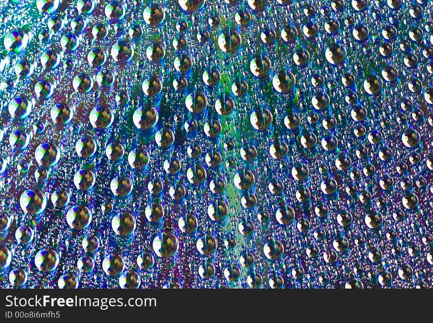 Macro of drops of water on a dvd disk. Macro of drops of water on a dvd disk