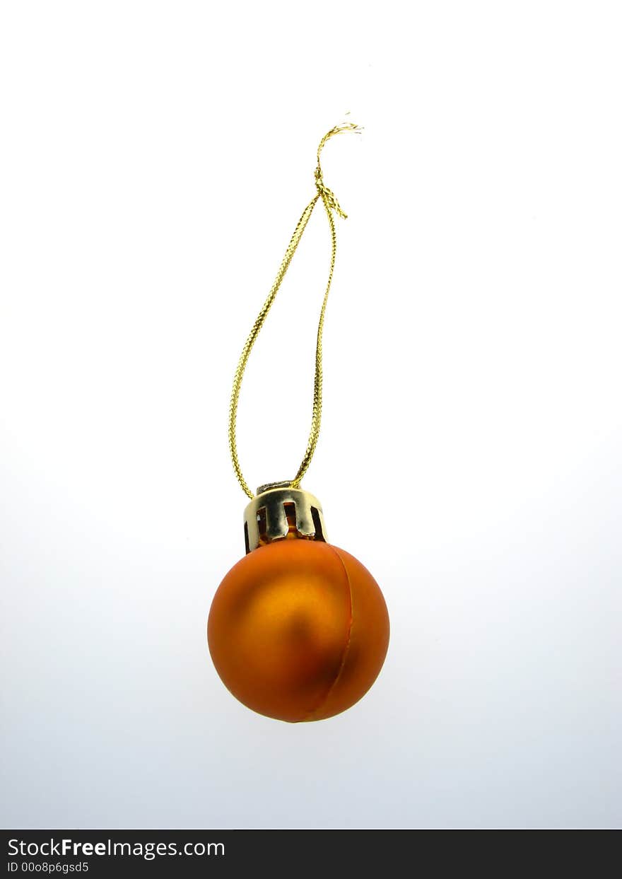 Fur-tree toy, orange - golden sphere on  white background. Fur-tree toy, orange - golden sphere on  white background