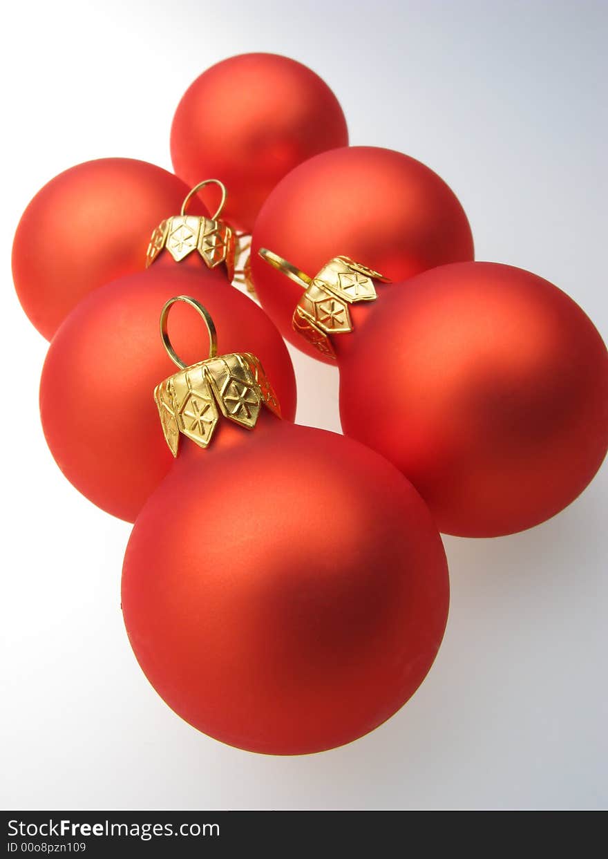 Fur-tree toys spheres of red color on  white background. Fur-tree toys spheres of red color on  white background