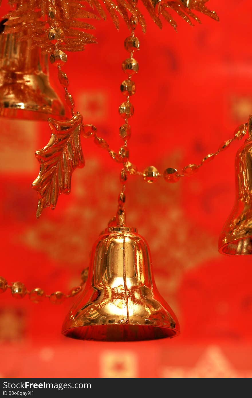 New-year handbells and Christmas tree on red background