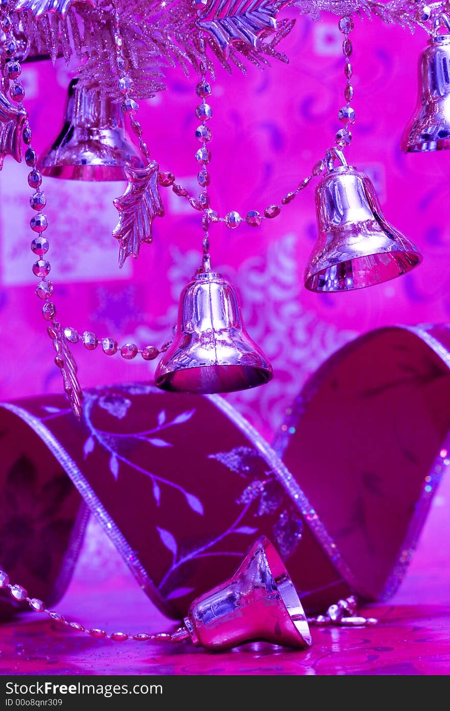 New-year handbells and Christmas tree on purple background