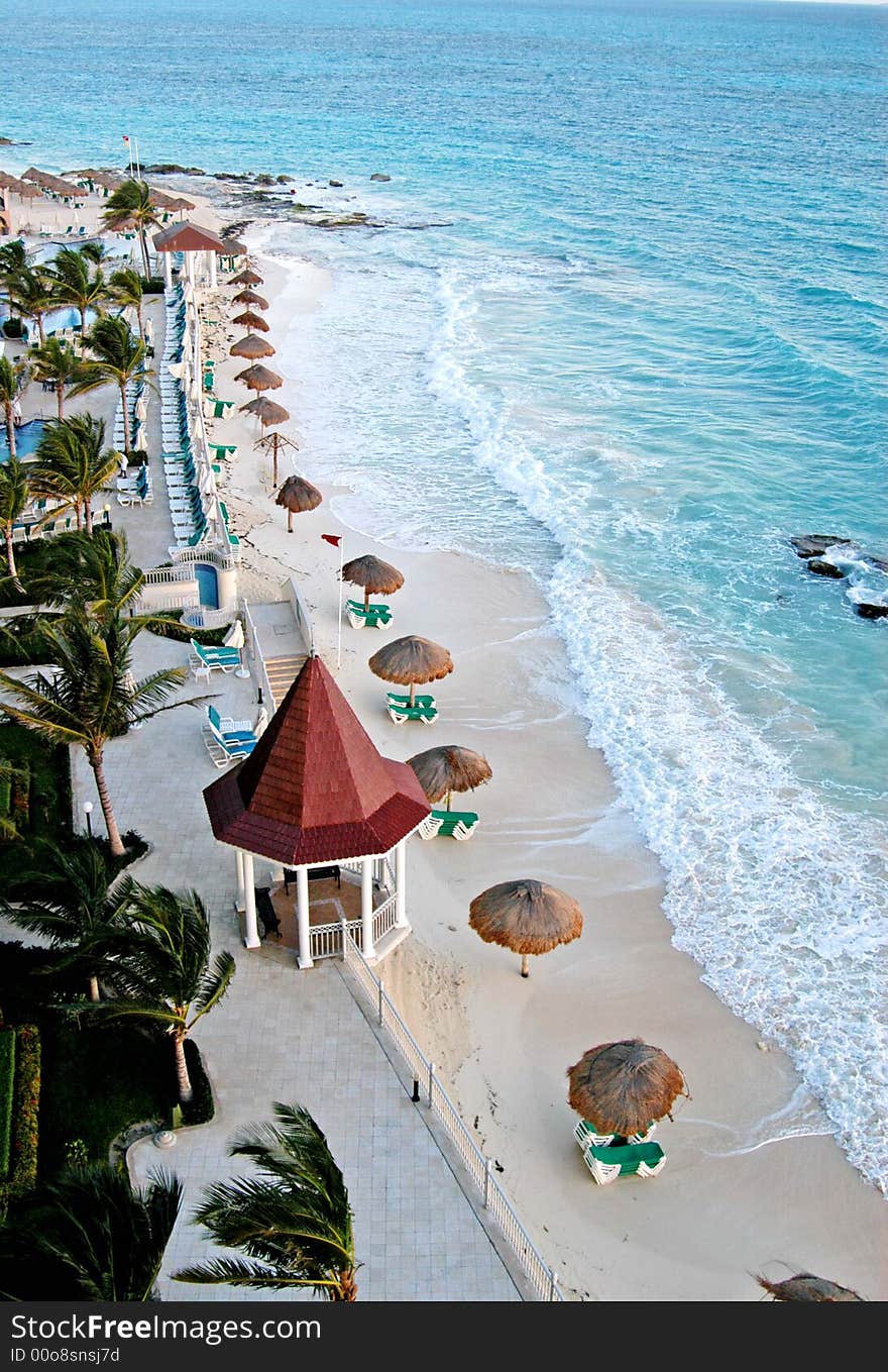 Gazebo ,Green chairs and umbrella early in the morning in the beach. Gazebo ,Green chairs and umbrella early in the morning in the beach