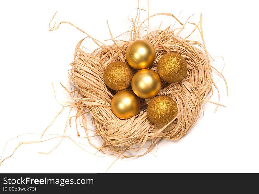 Basket with gold eggs and a New Year's toy. Basket with gold eggs and a New Year's toy