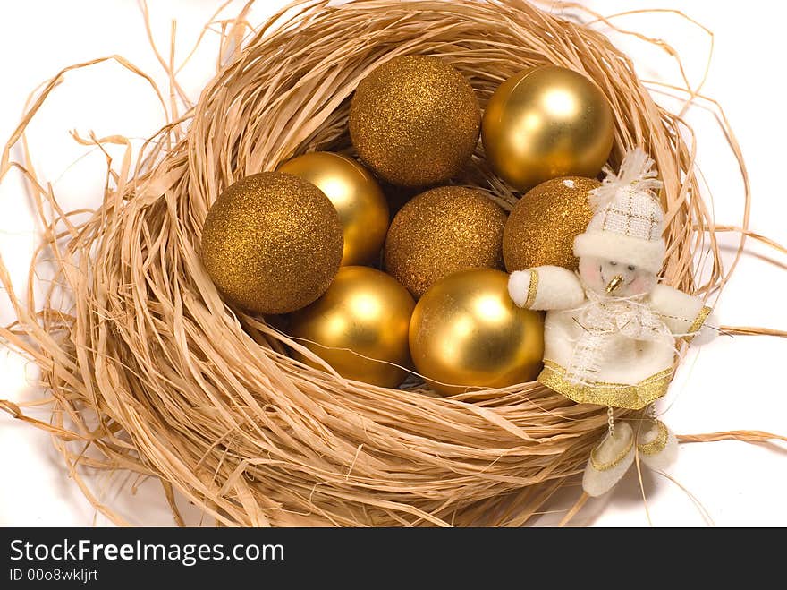 Basket with gold eggs and a New Year's toy. Basket with gold eggs and a New Year's toy