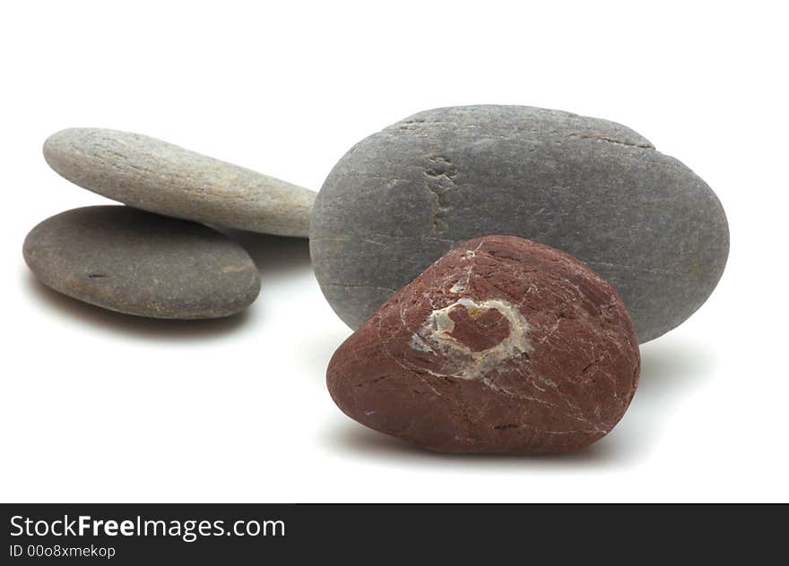 Red pebble with a heart sign