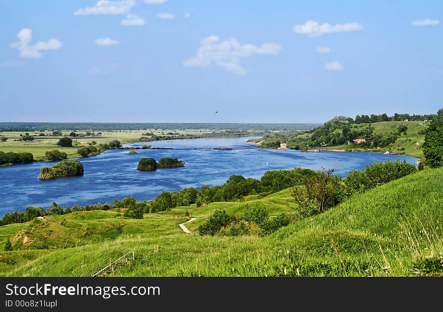 Coast of the river and boat in a sunny day. Coast of the river and boat in a sunny day