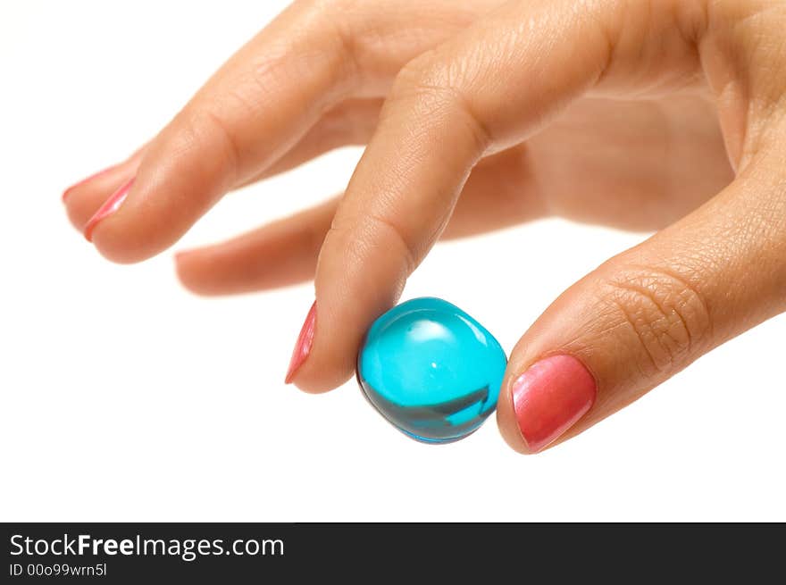 Bath oil ball held by woman over white. Bath oil ball held by woman over white