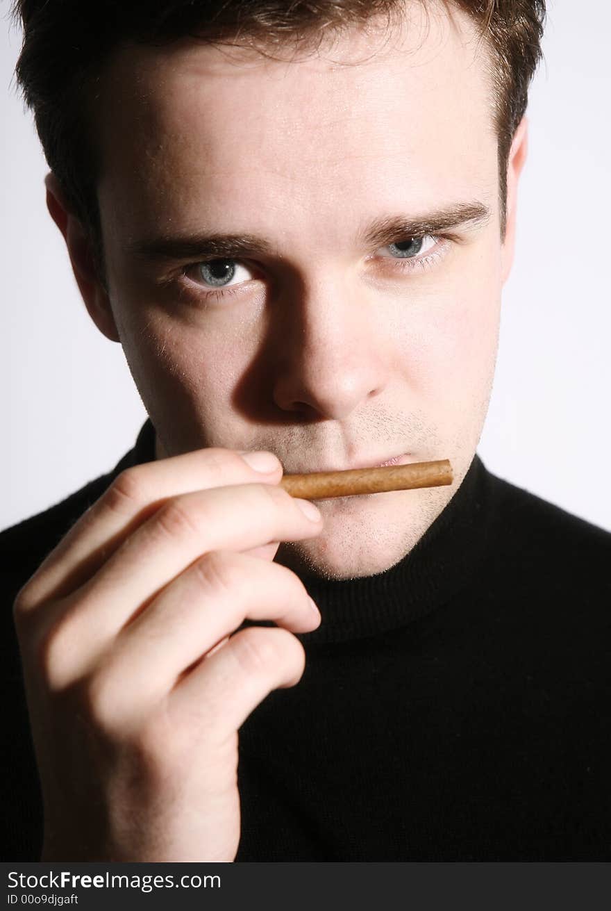 Portrait of a man with a cigar. Portrait of a man with a cigar